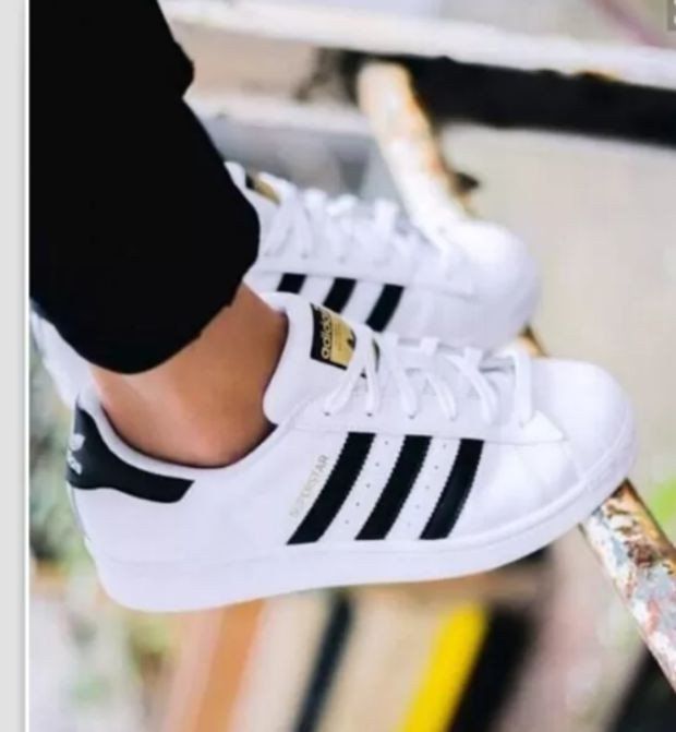 white shoes with golden stripes