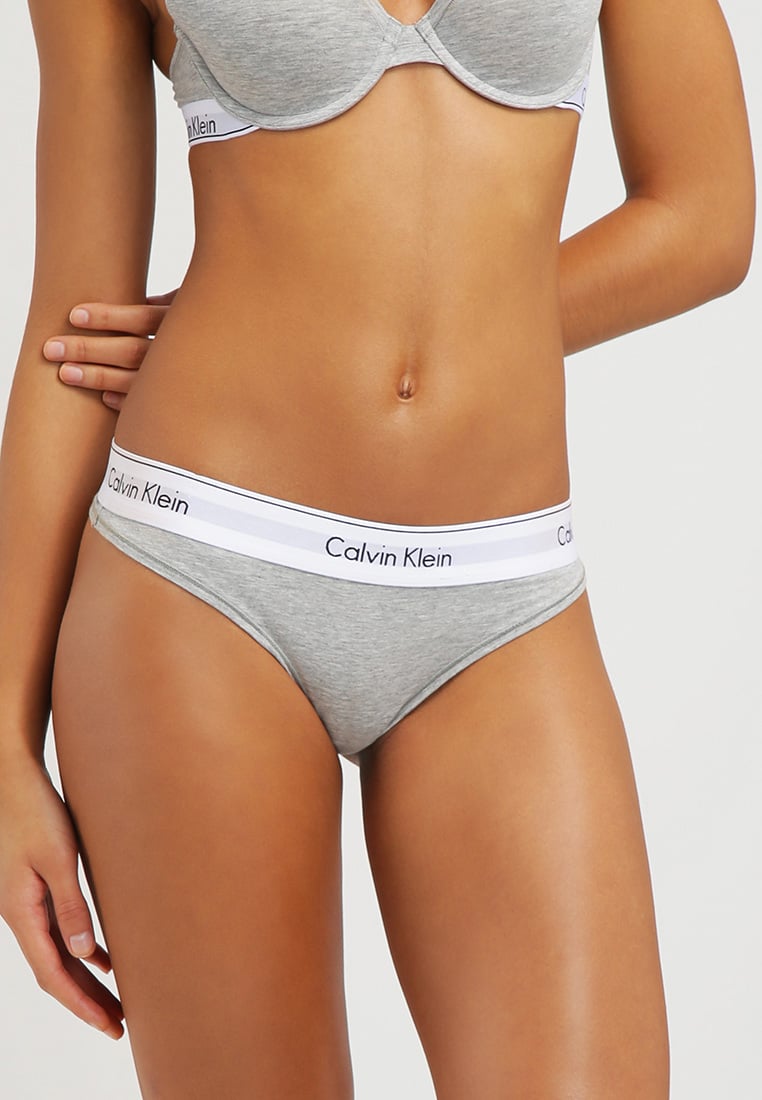 Стринги Кельвин Кляйн серые. Трусы Kelvin Kline. Calvin Klein Gris.